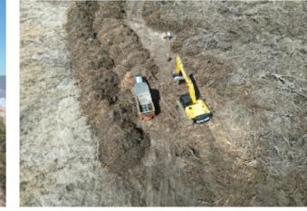 Máquina escavadeira trabalhando na orla durante a fase costeira da obra